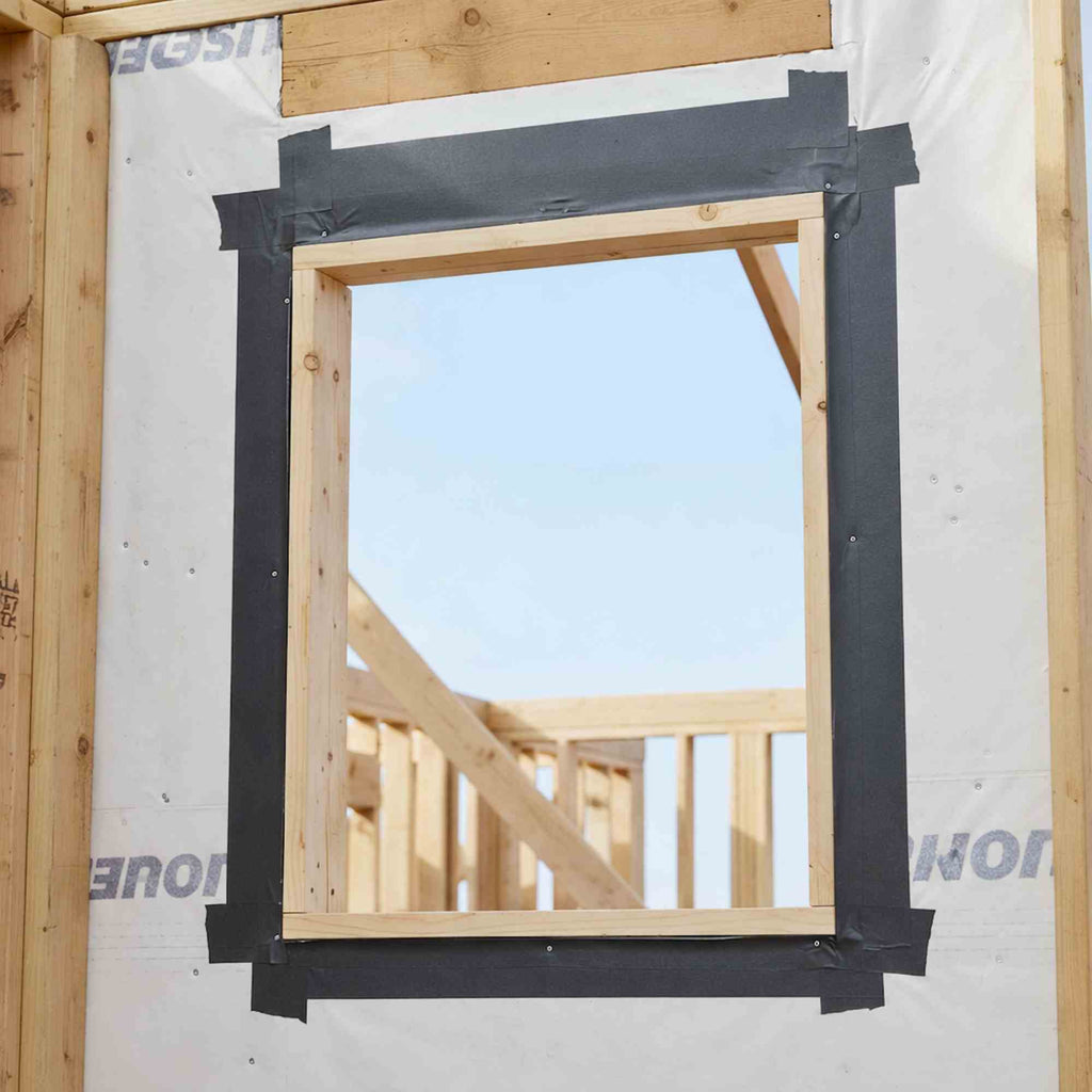 Butyl flashing tape installed around a window opening for exterior waterproofing